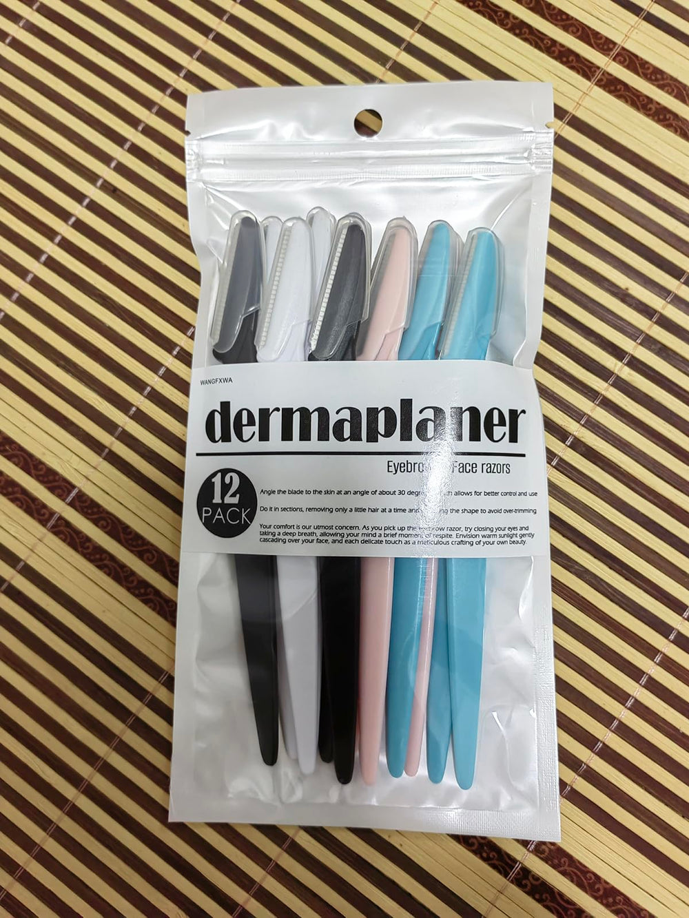 WANGFXWA DermaPlane Razor in white for clean lines and smooth skin prep.