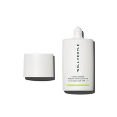 Well People Daygleamer bottle closeup shows silky mineral sunscreen