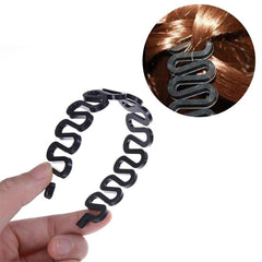 Wendy Mall black braiding tool with hook ready for DIY twists.