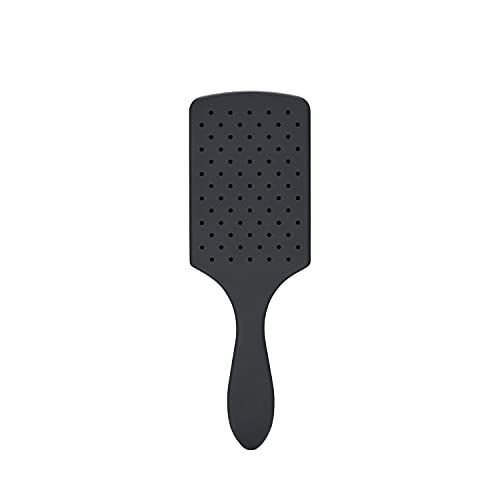 Wet Brush charcoal-infused bristles closeup showing oil absorption.