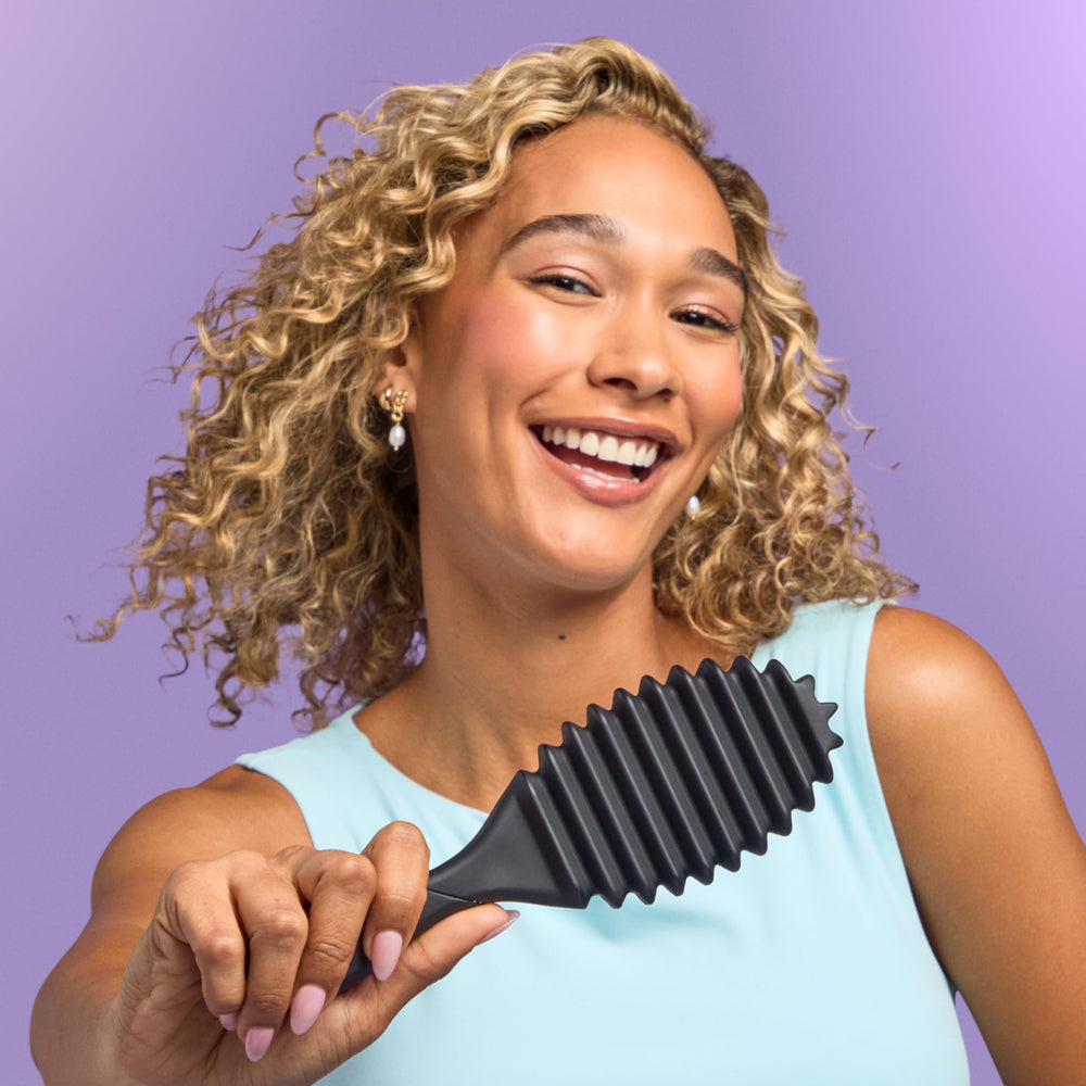 Wet Brush Curl Shaper for curly and coily textures during post-wash styling.