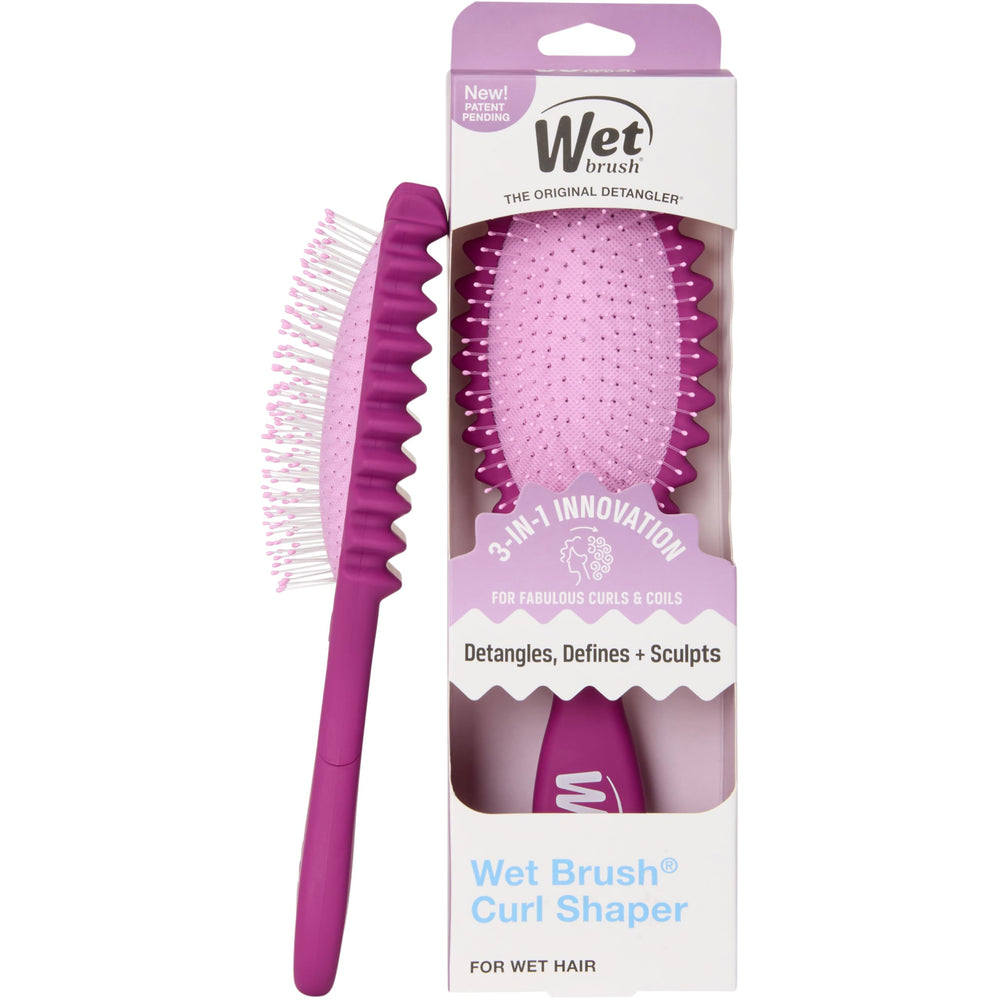 Wet Brush Curl Shaper in hand detangles wet curls gently for smooth styling.