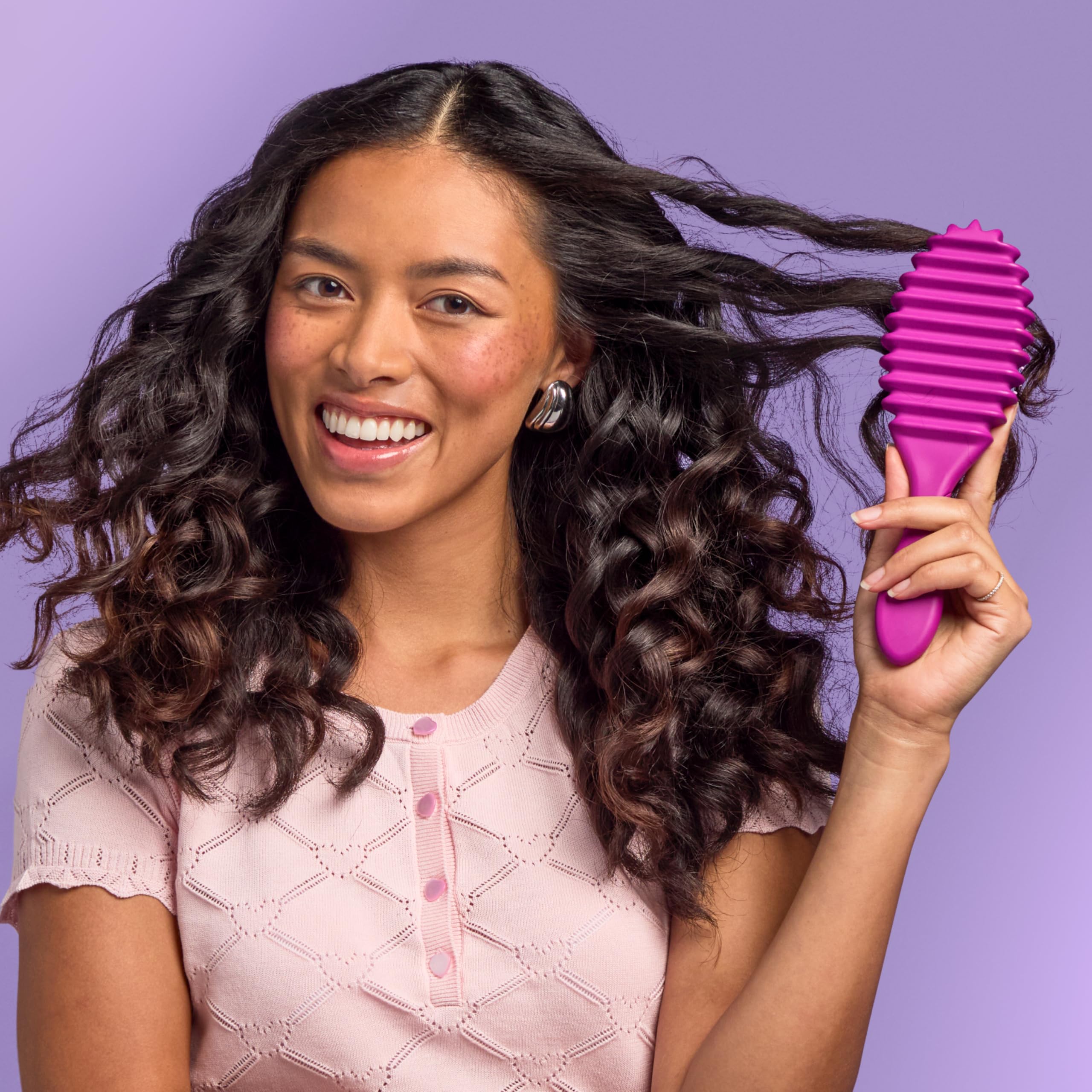 Wet Brush Curl Shaper post-swim refreshes pool-tousled curls quickly.