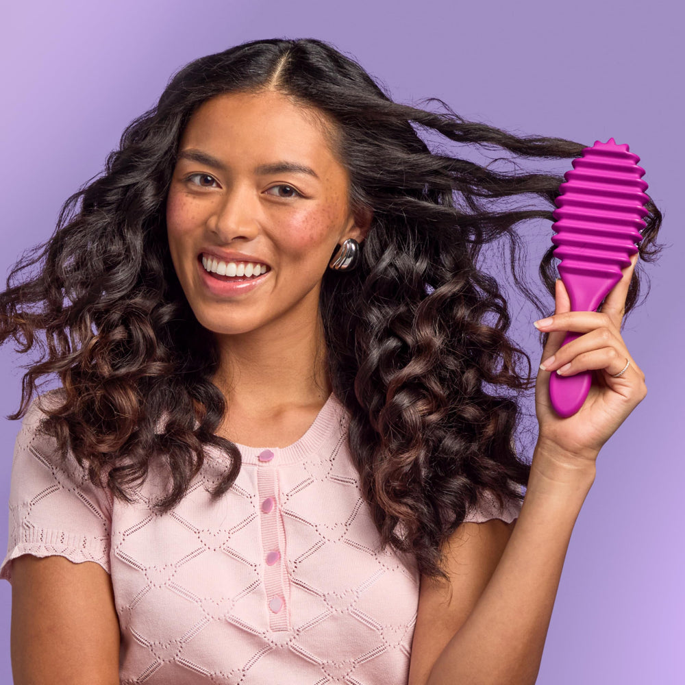 Wet Brush Curl Shaper post-swim refreshes pool-tousled curls quickly.