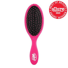 Wet Brush detangling on wet hair in pink reduces pulling and breakage