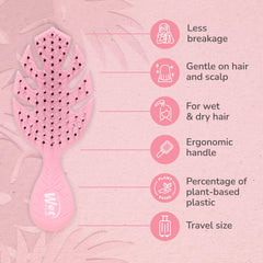 Wet Brush Go Green Mini Detangler Pink packaging highlights eco-friendly materials