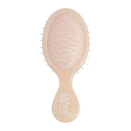 Wet Brush Mini Detangler – bristles glide through knots to reduce tug.