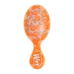 Wet Brush Mini Detangler in peach Tutti Frutti color eases knots with gentle detangling.