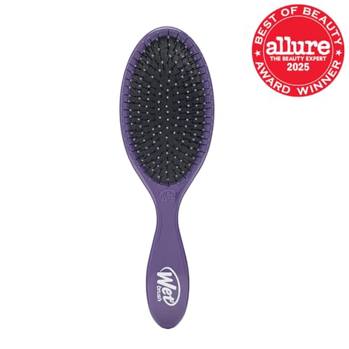 Wet Brush Original Detangler Purple in hand ready for effortless brushing.