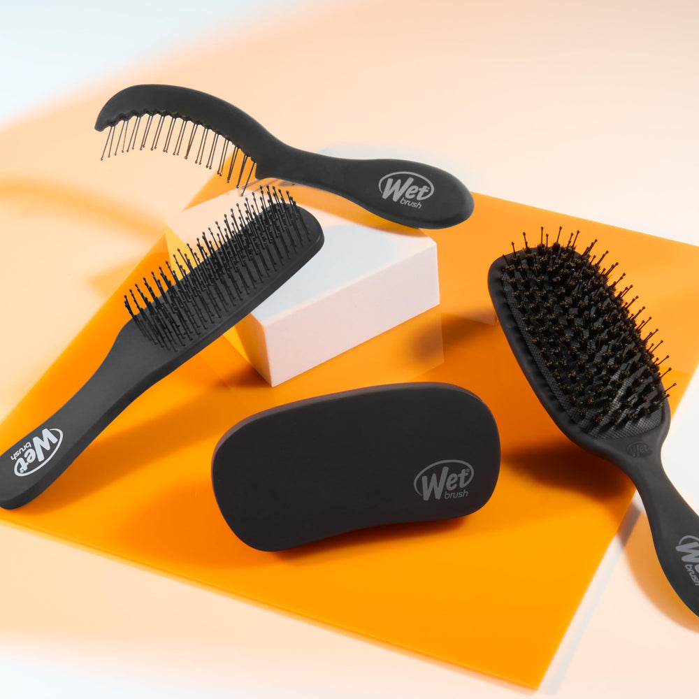 Wet Brush Shine Enhancer packaging shot highlighting compact design for travel