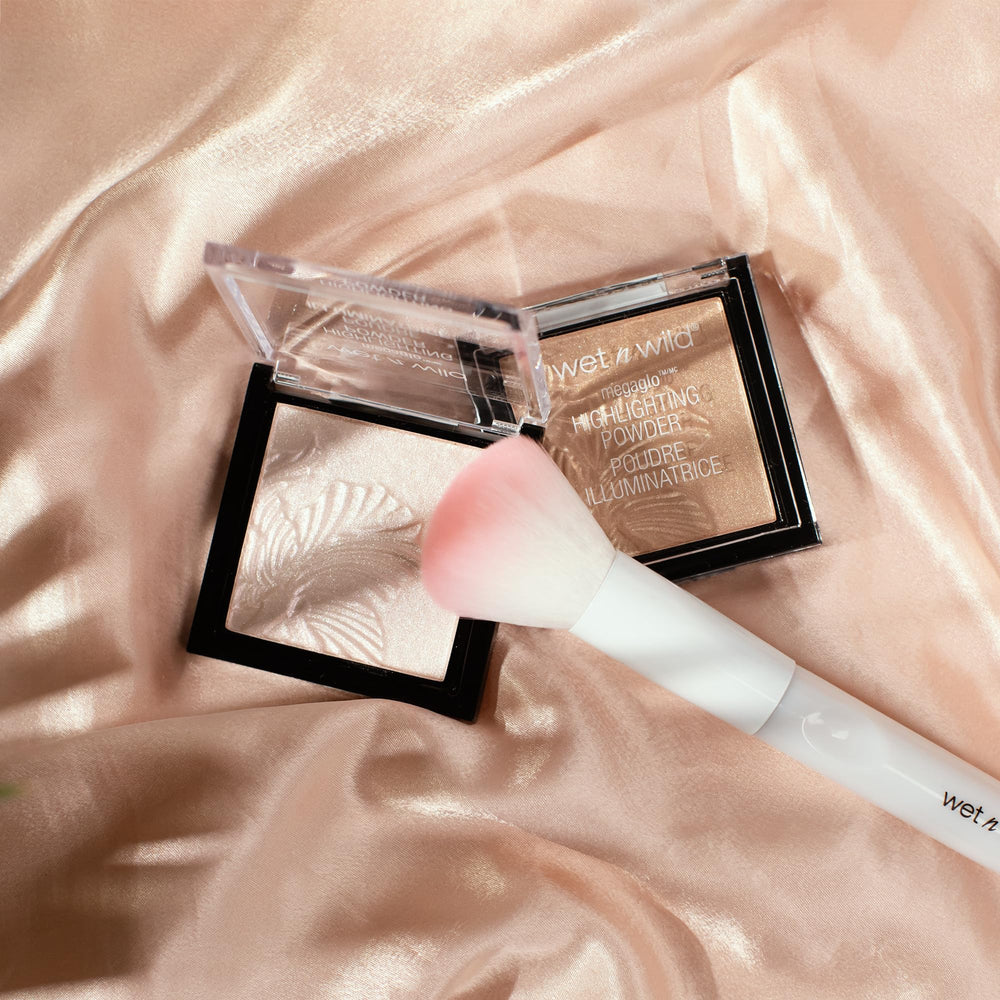 Wet n Wild MegaGlo arm swatch reveals champagne glow.