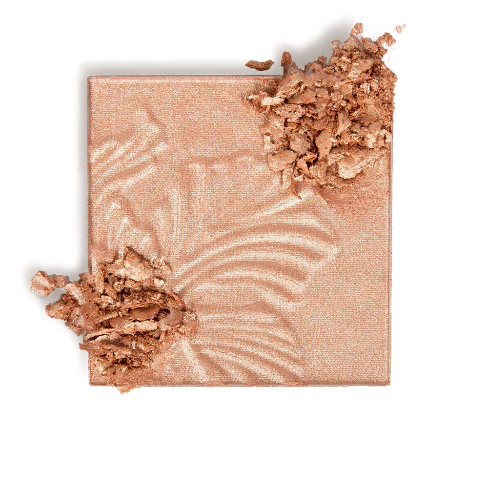 Wet n Wild MegaGlo highlighting powder brush application on skin for seamless blend.