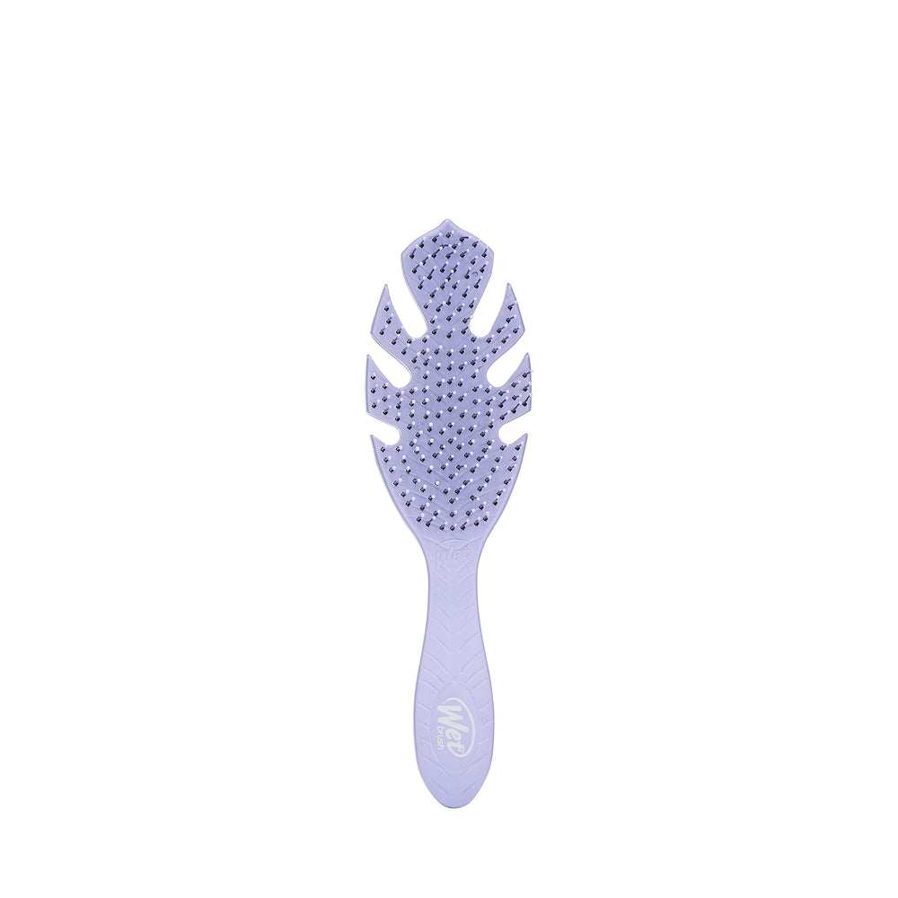 Wet Brush Go Green Detangler Purple close-up gliding through knots