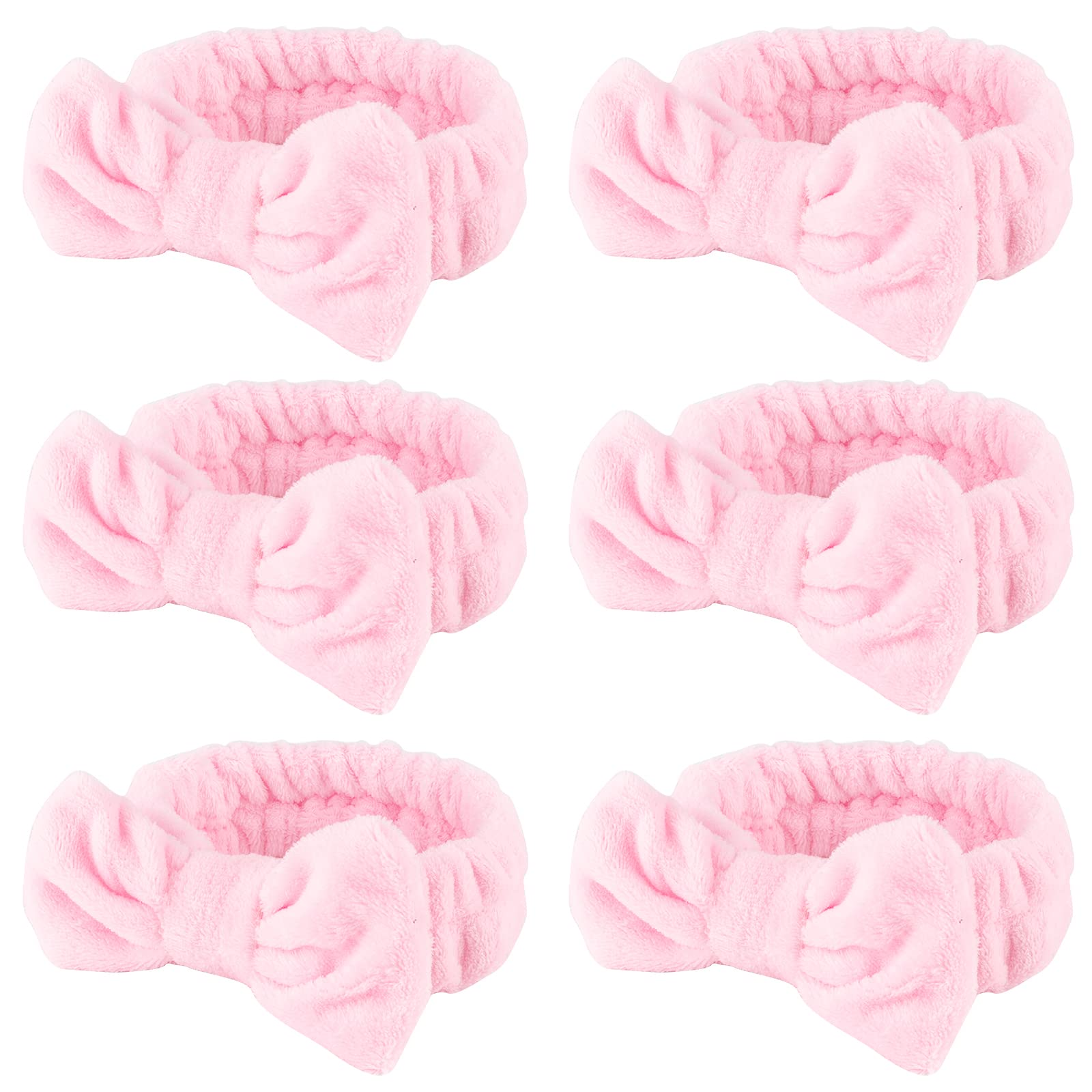 WHAVEL banda spa rosa con lazo para mantener el cabello durante la limpieza facial.