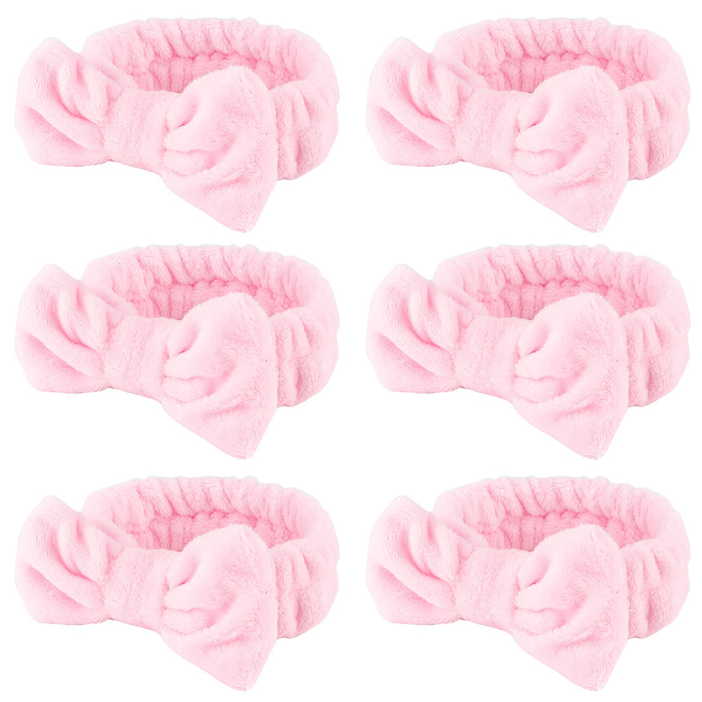 WHAVEL banda spa rosa con lazo para mantener el cabello durante la limpieza facial.