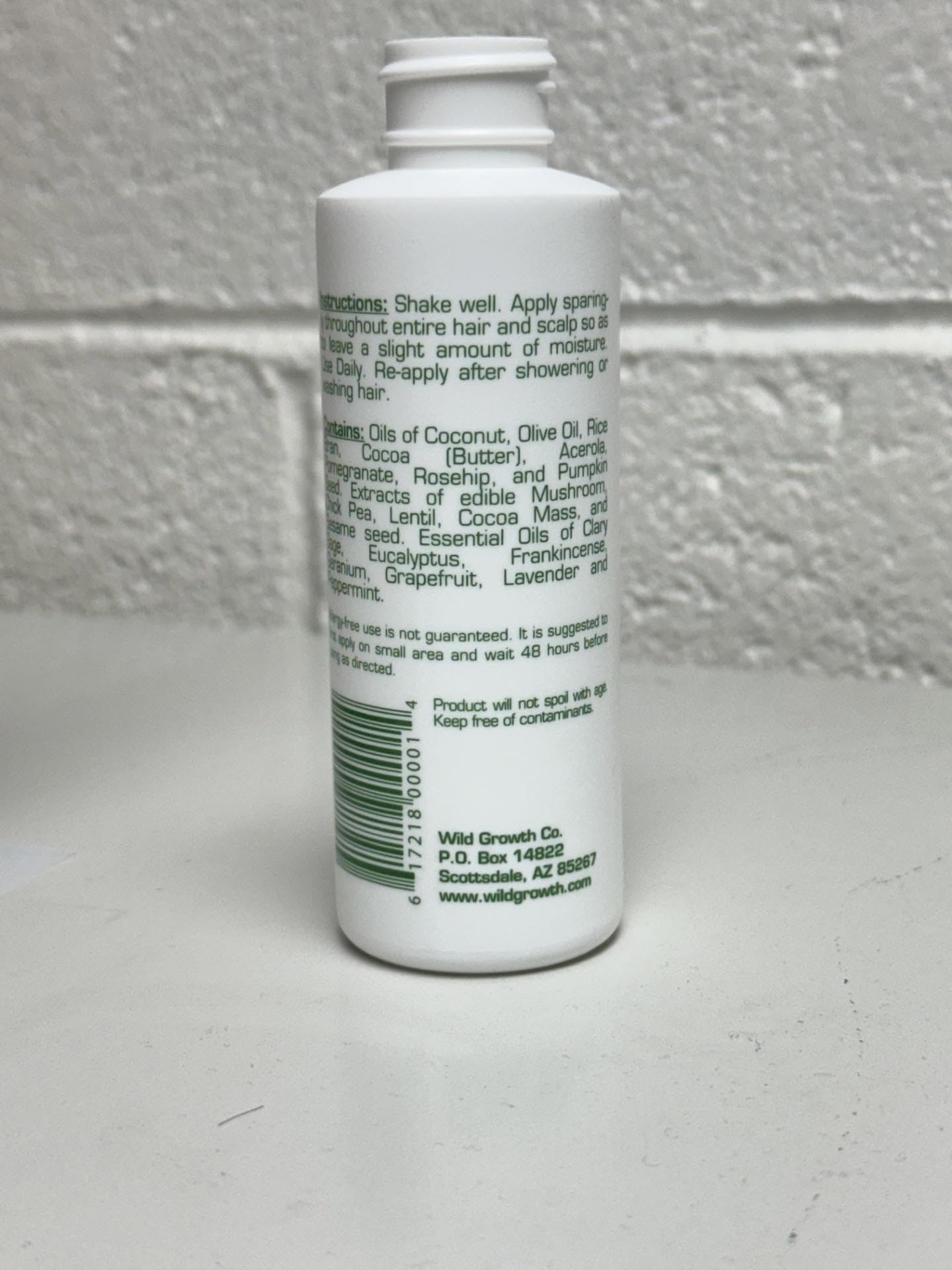 Wild Growth Hair Oil being applied for smoother, more manageable hair