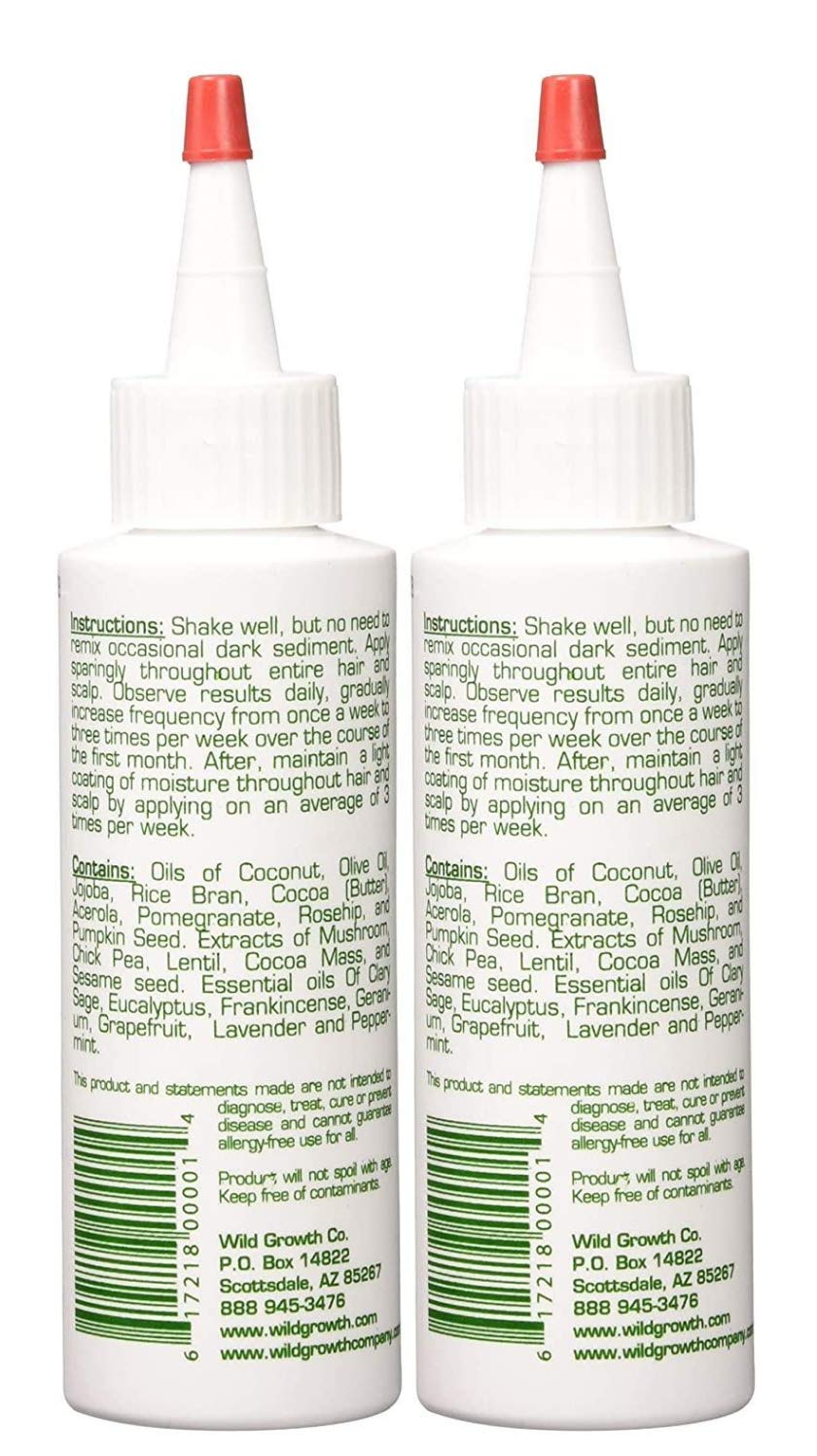 Wild Growth Hair Oil bottle with drops illustrates a lightweight, quick-absorb formula.