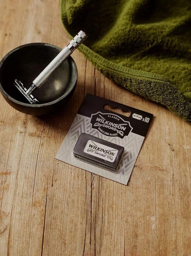 Wilkinson Sword Classic DE blades loading in a razor demonstrates quick setup for daily routines.