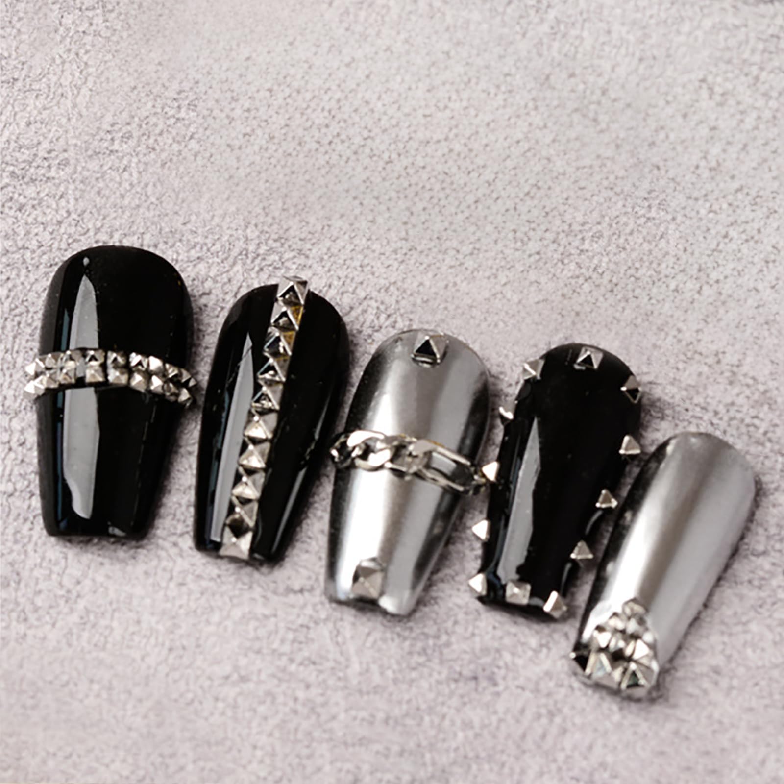WOKOTO pyramid studs applied to nails for a punk-inspired look