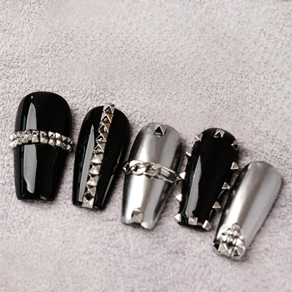 WOKOTO pyramid studs applied to nails for a punk-inspired look
