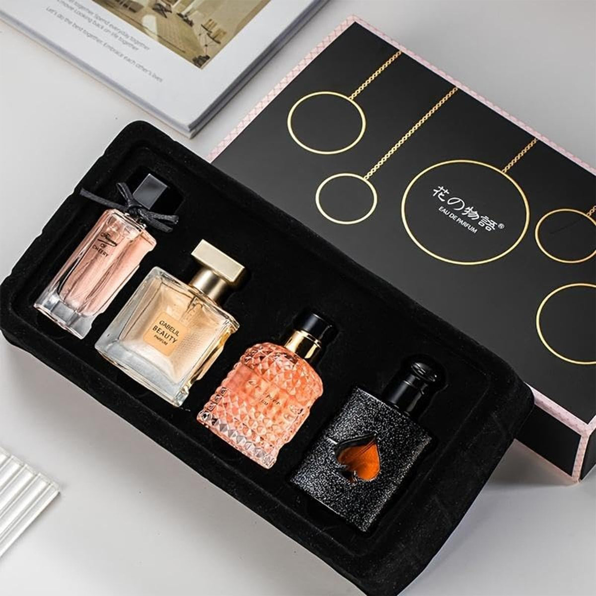 Women's perfume set gift box with four fragrances, ideal for gifting.