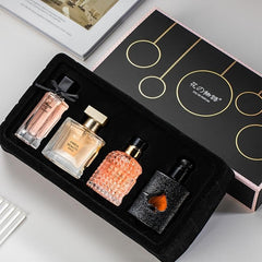Women's perfume set gift box with four fragrances, ideal for gifting.