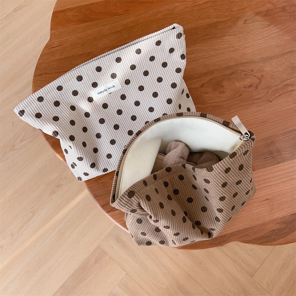 Wudygirl makeup bag open with cosmetics neatly organized.
