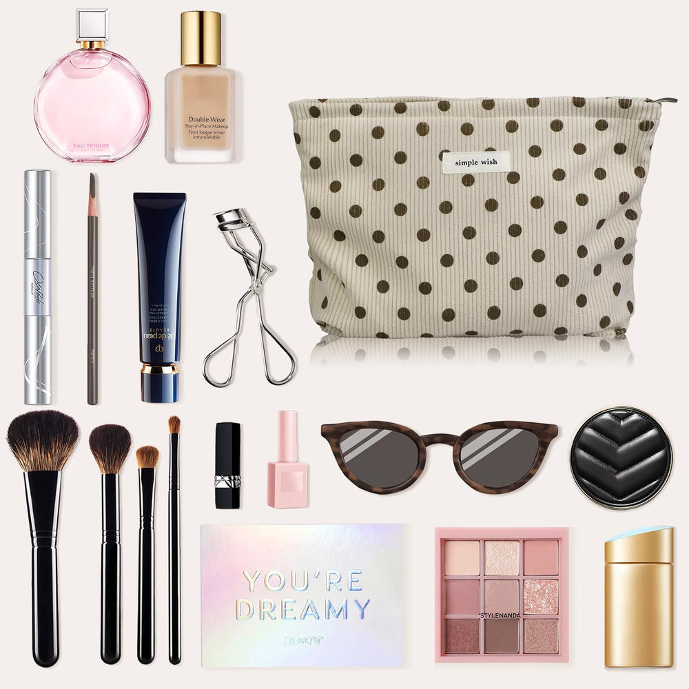 Wudygirl travel-ready makeup bag nestled in a handbag.