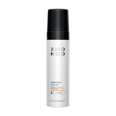 XMONDO Wavetech bottle close-up highlighting vegan formula and strong hold.