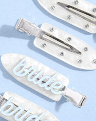 Clips xo Fetti con cristales brillantes para un look de boda reluciente.