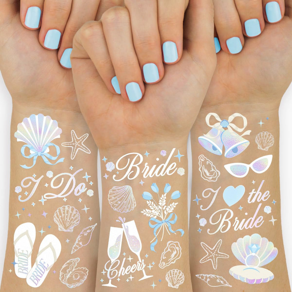 xo, Fetti seashells and wedding bells tattoos on the wrist for coastal glow in photos.