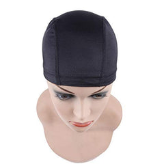 The dome cap stretches to fit different hair lengths during wig prep.