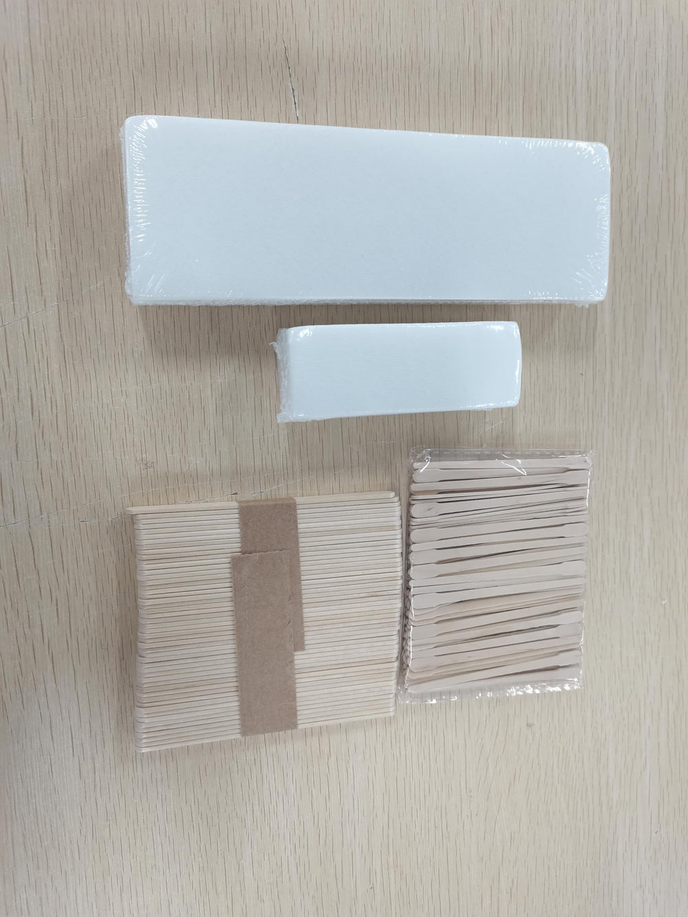 Yaomiao wooden sticks application; clean, even wax distribution.