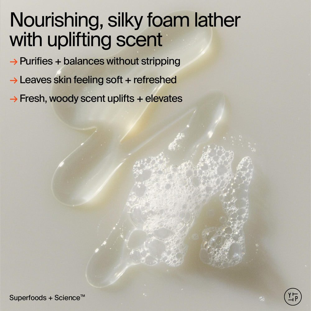 Youth To The People body wash lather in hand showing creamy, gentle cleansing.