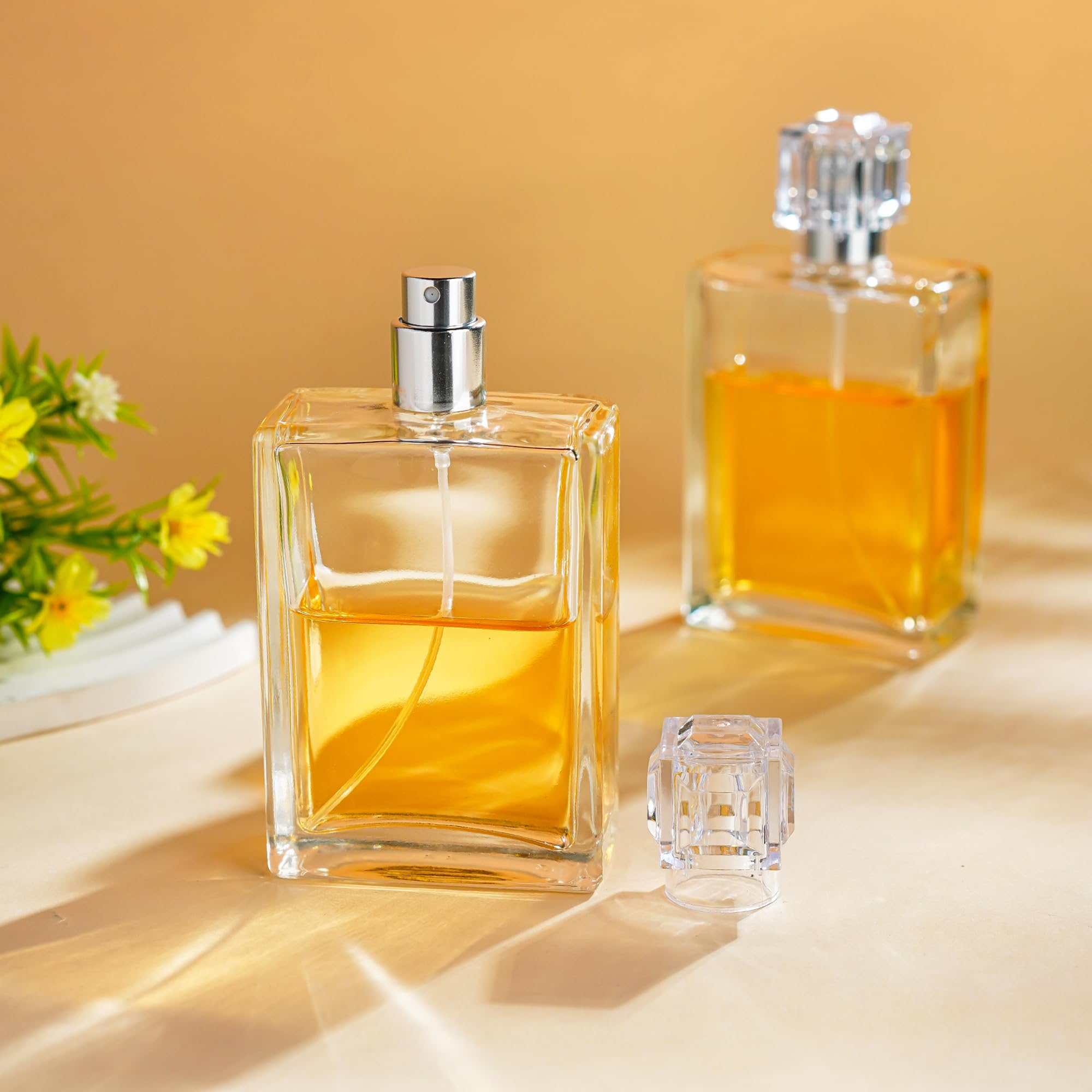 Close-up of YU FENG square glass perfume bottle showing clear material.