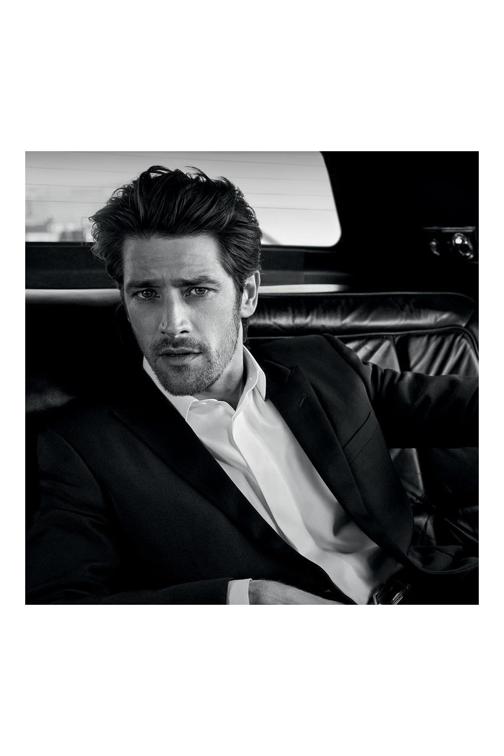 YSL L'Homme bottle top spray, precise scent release for easy application.
