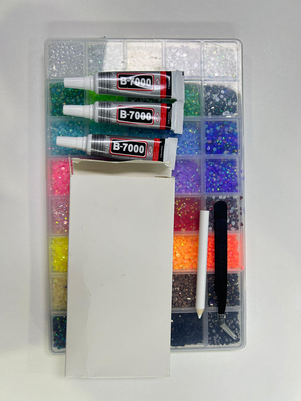 Zefy craft and nail projects with colorful rhinestones.