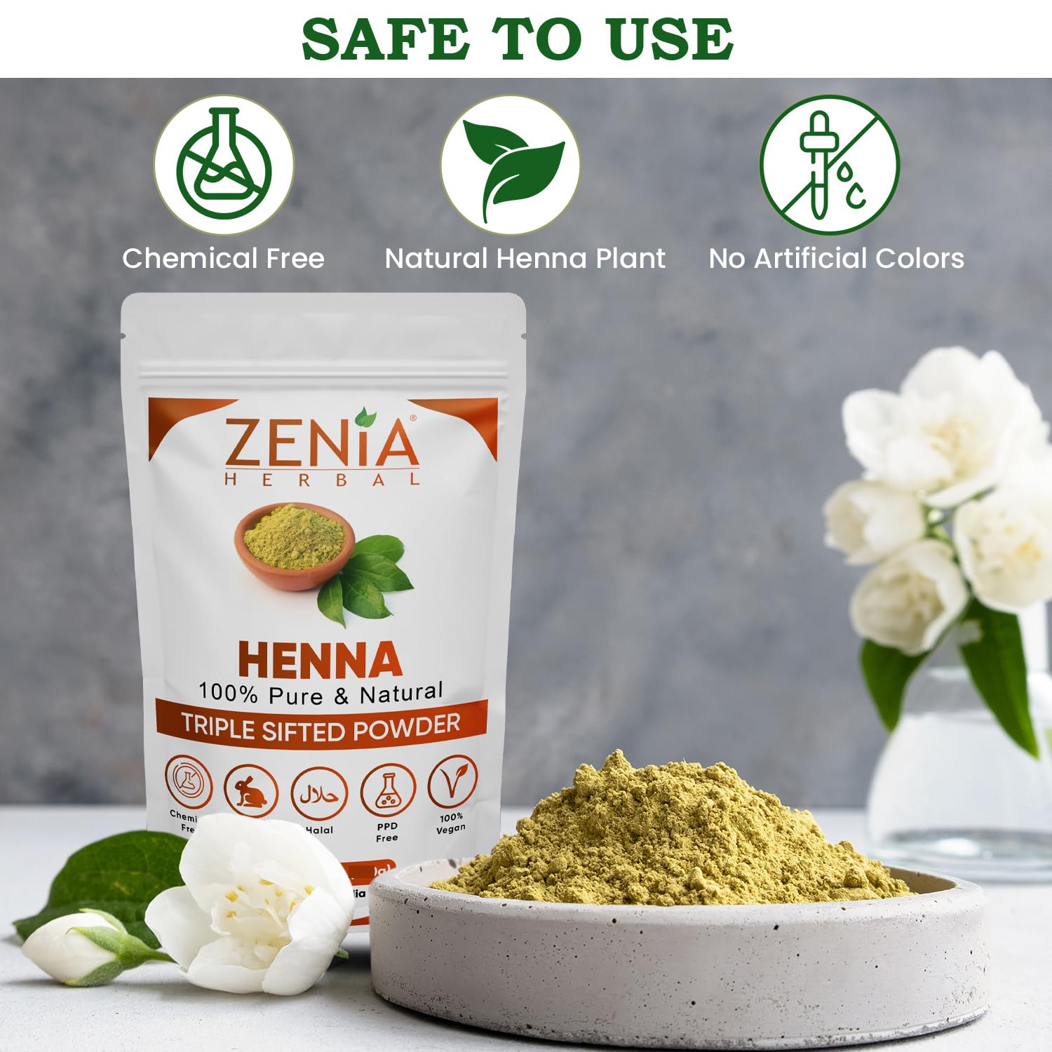 Zenia henna paste application shows vibrant orange-red tint for customized shade results.
