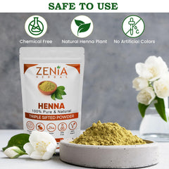 Zenia henna paste application shows vibrant orange-red tint for customized shade results.