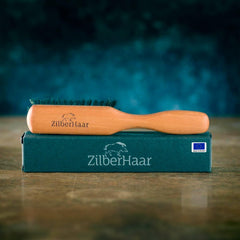 ZilberHaar beard brush features a solid wood handle for a comfortable grip.