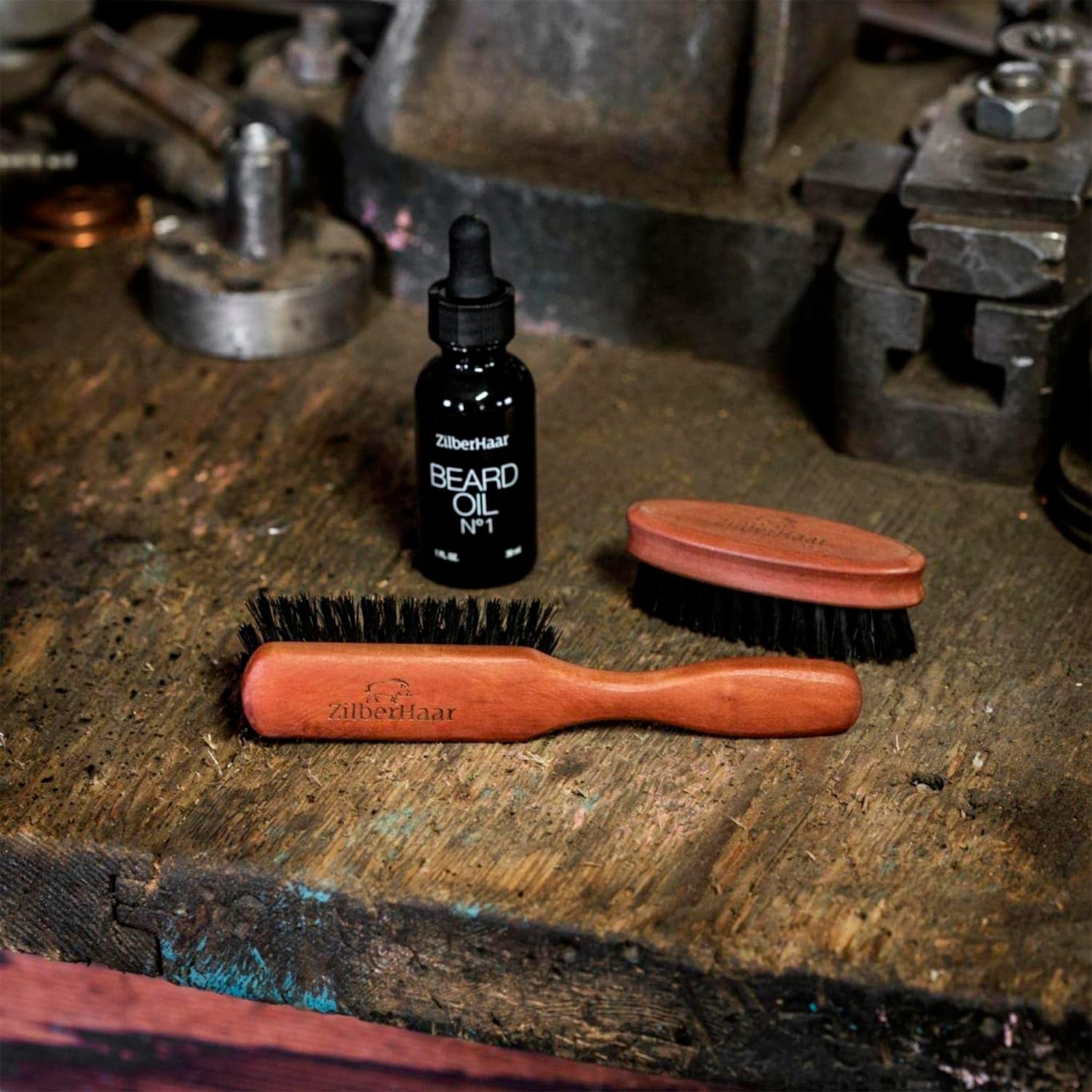 Applying beard oil with ZilberHaar brush improves absorption and control.