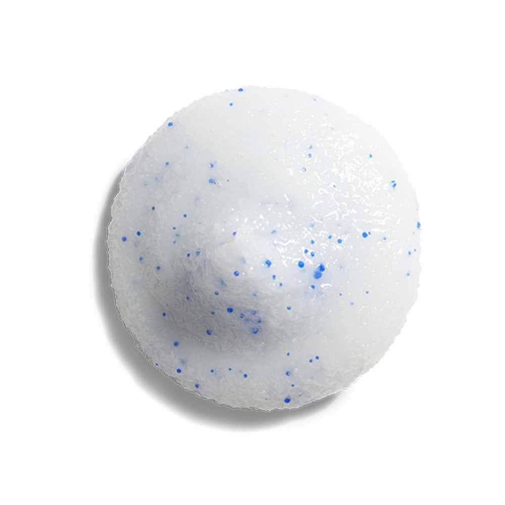 Close-up of ZO SKIN HEALTH Dual Action Scrub texture with exfoliating particles.