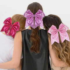 Zolyco glitter bow clip hot pink worn on hair creates playful look